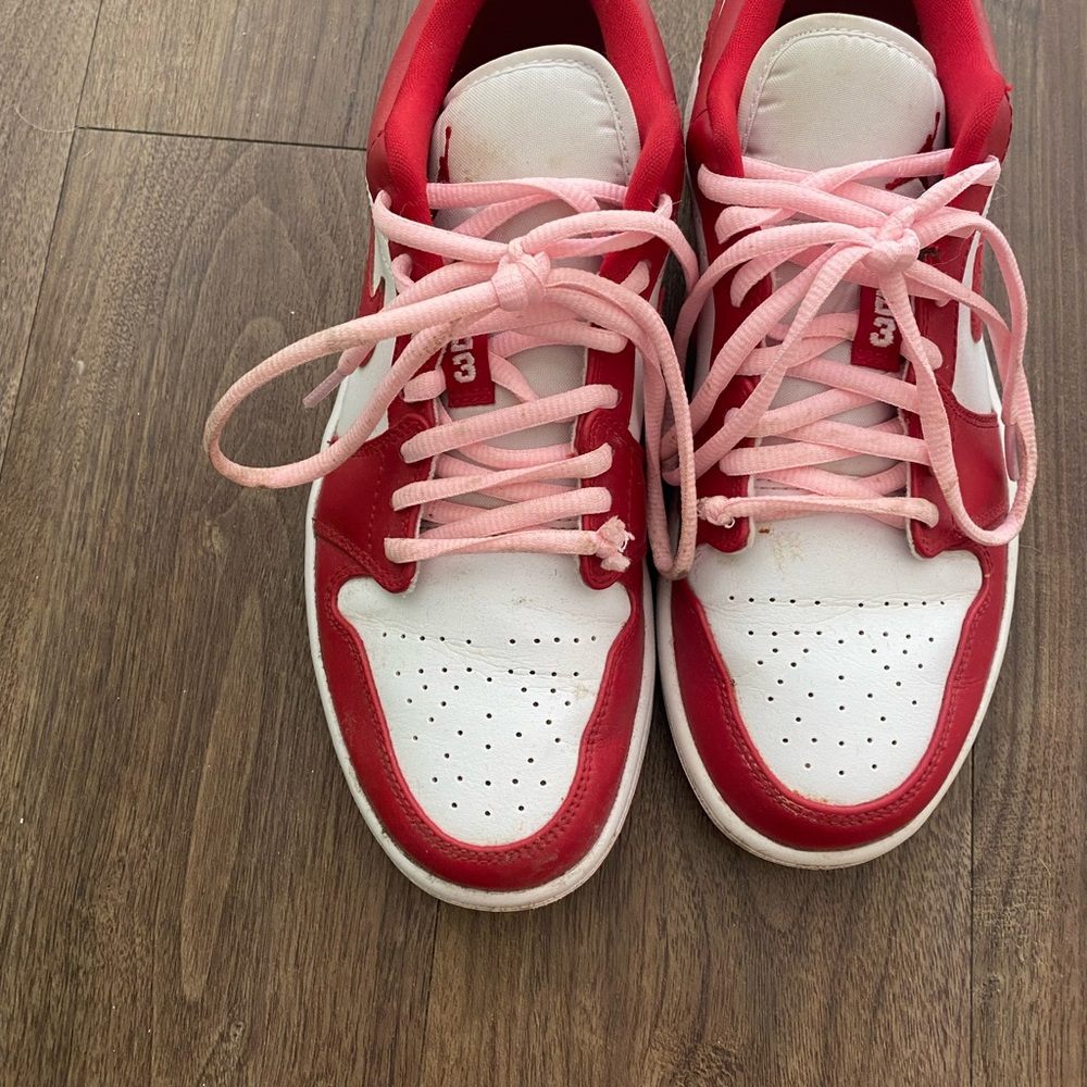 Red Nike Jordan’s with light pink laces in size 8.5 W